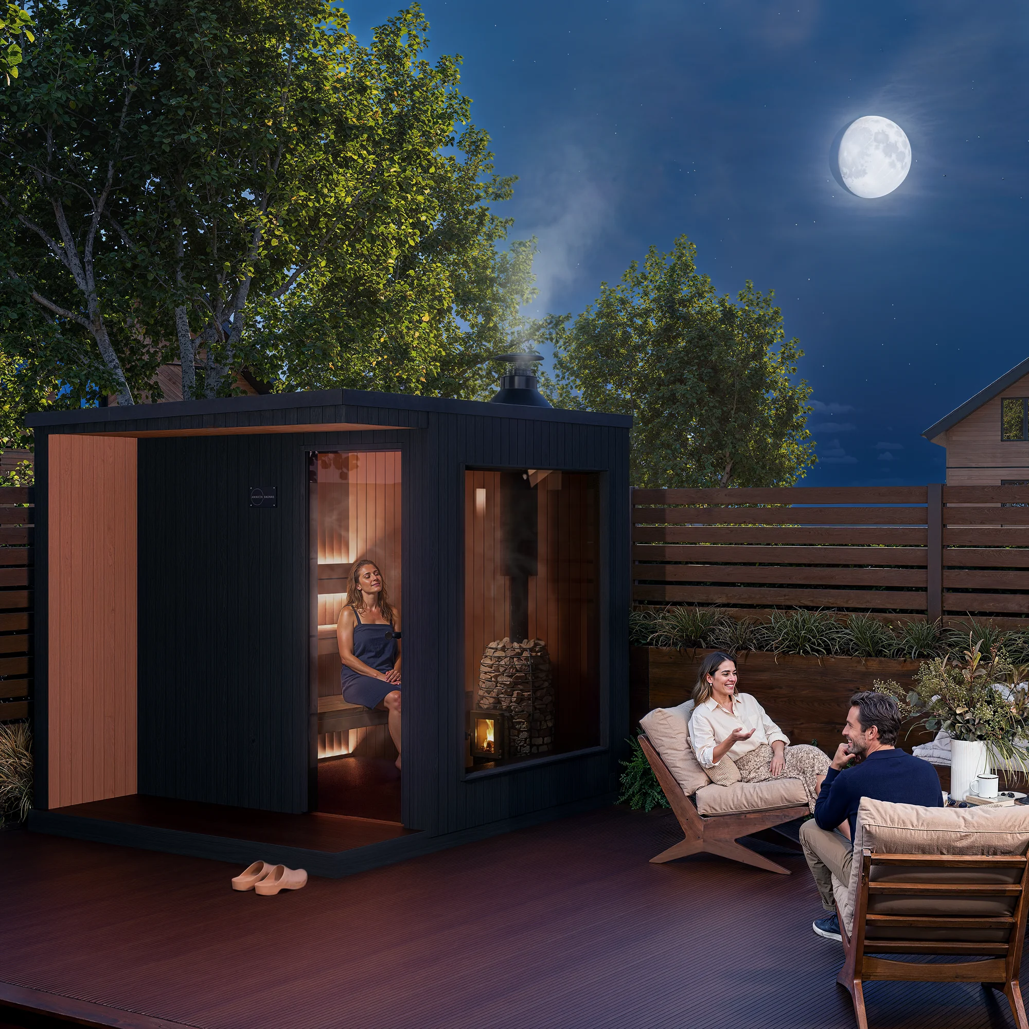 Moonlit night render of an Awaken Saunas bespoke outdoor sauna with steam and warm interior glow